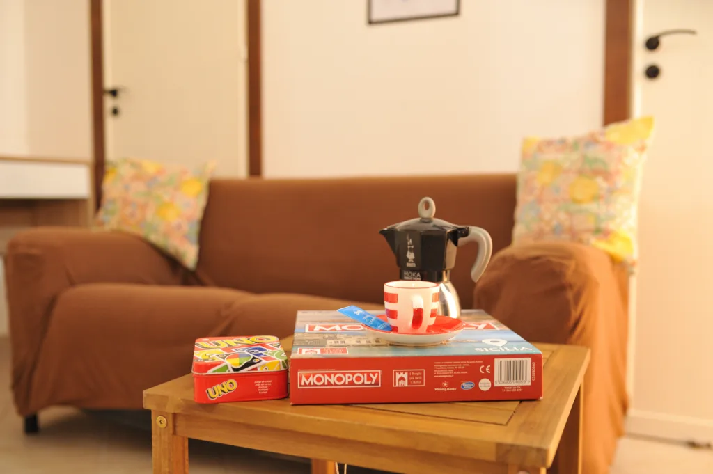 Sofa with board games https://terrasinipalermovacation.com